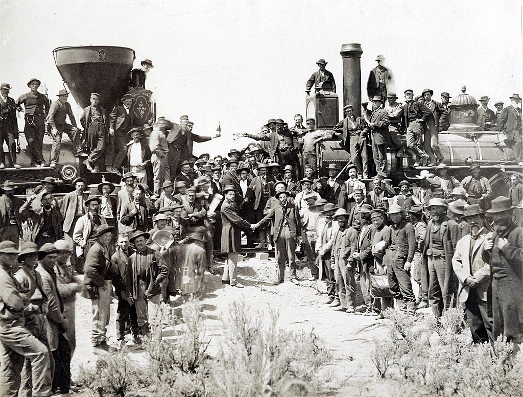 Photo by A.J. Russell of the celebration following the driving of the "Last Spike" at Promontory Summit, Utah, May 10, 1869. Because of temperance feelings the liquor bottles held in the center of the picture were removed from some later prints.