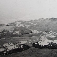 An "Eire" sign placed on the coast to warn aircraft that they were in the airspace of neutral Ireland. Eire sign 1950s-cropped.jpg