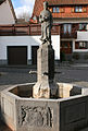 Brunnen mit Denkmal für Pfarrer Clemens Langenhof