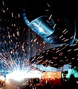 A man gas metal arc welding.