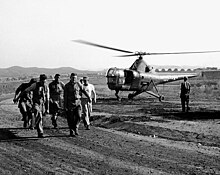 Navy Corpsmen help carry a wounded man from a VMO-6 HO3S-1 helicopter to a hospital in Korea in October 1950. HO3S from VMO-6 in Korea Oct 1950.jpg