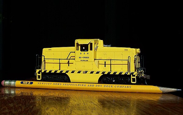 HO scale (1:87) model of a North American center cab switcher shown with a pencil for size