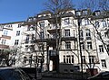 Apartment building in closed development with front garden