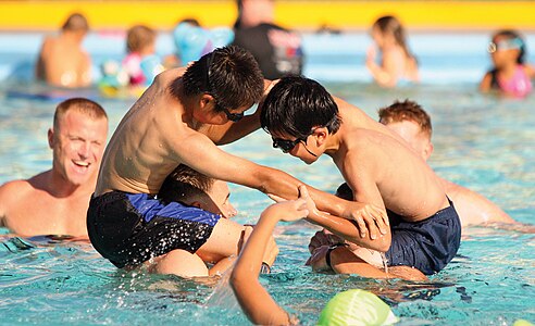 Japanese children play water games at Camp Foster