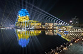 Kaohsiung Music Center and Lingyaliao Railroad Bridge lit with Ukrainian flag colors during 2022 Taiwan Lantern Festival (cropped)