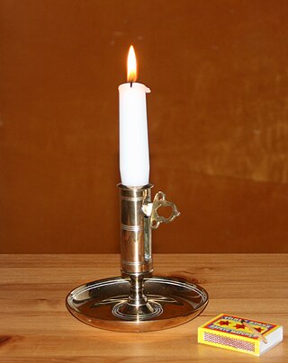 <span class="mw-page-title-main">Candle</span> Wick embedded in solid flammable substance