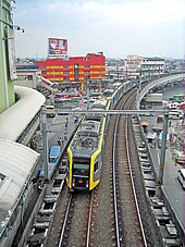A Line 1 train approaching EDSA station LRT1-Manila towards Taft Station.jpg