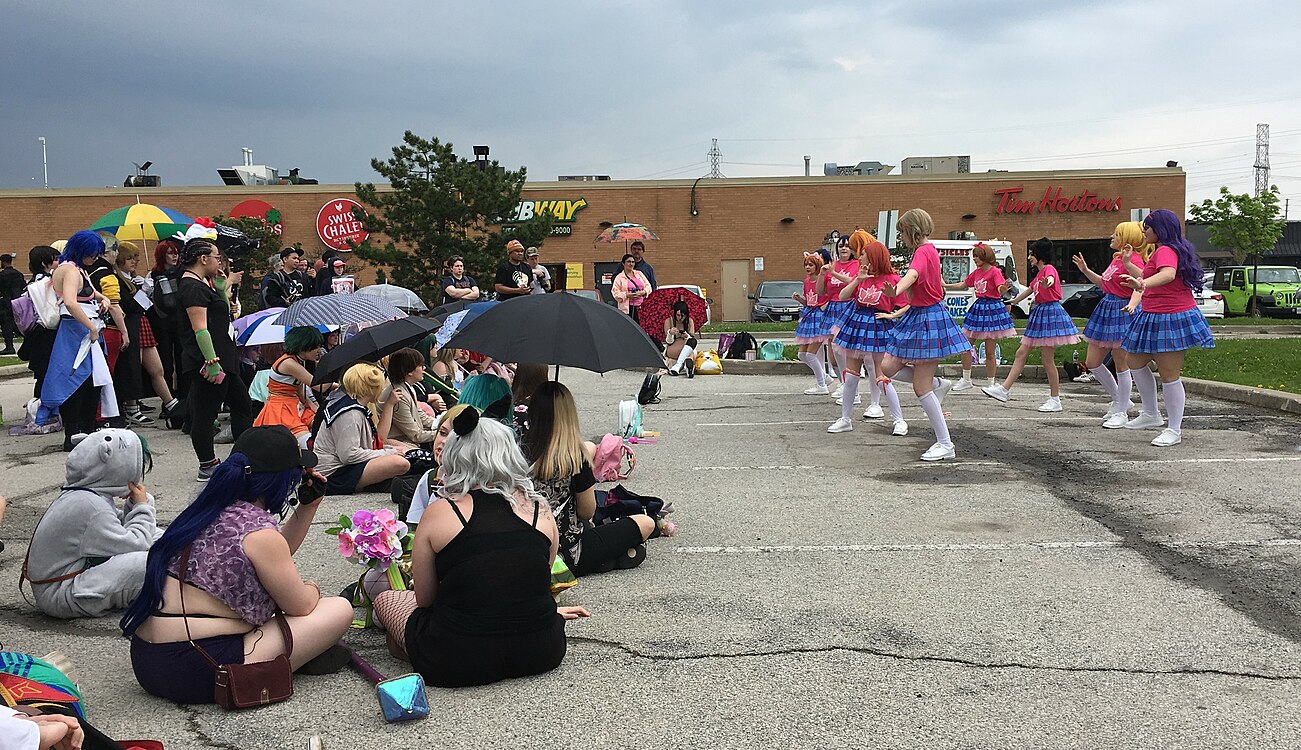 Members of μ's cosplayers dancing at Anime North, left side 20190525.jpg