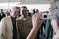 Michael Douglas poses for a photo with Chief Yeoman Randy Temple at Naval Air Station Sigonella, Sicily, June 19, 2004