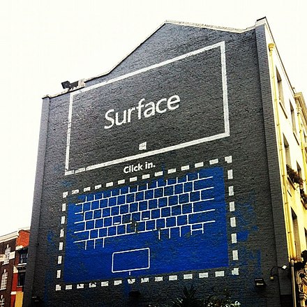 A Surface advert painted on the side of a building