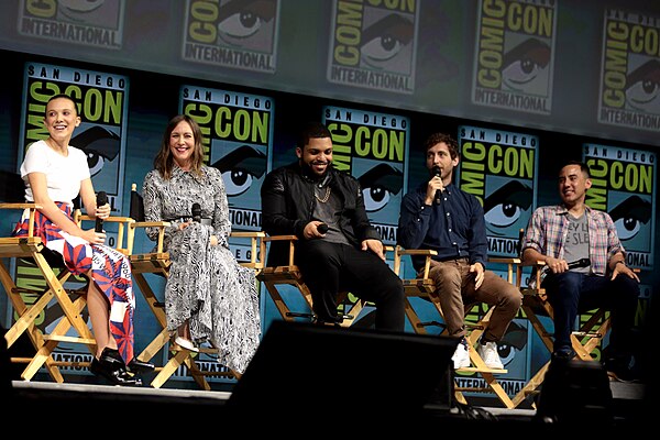 From left to right: Millie Bobby Brown, Vera Farmiga, O'Shea Jackson Jr., Thomas Middleditch, and Michael Dougherty speaking at the 2018 San Diego Com