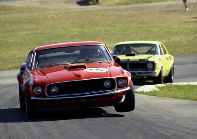The Ford Mustang Boss 302 Group C Improved Production Touring Car of Allan Moffat leading the Super Falcon of Pete Geoghegan at Lakeside in 1972