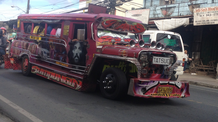A patok jeepney plying the route Montalban-Cubao. They are known for reckless driving, loud music, bright lights and colorful designs.