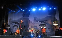 As a solo performer, Morrissey typically featured older imagery as his stage backdrop, as seen here at a 2011 performance in Berlin