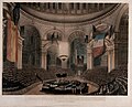The coffin of Horatio Nelson in the crossing of Saint Paul's Cathedral during his state funeral, with the dome hung with captured French and Spanish flags, 1806.