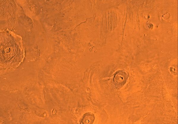 Image of the Tharsis Quadrangle (MC-9). The region contains the Olympus Mons, Ascraeus Mons and Pavonis Mons, three of the four largest shield volanoe