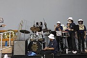 Peter demonstrates his ability to play the drums amongst percussion members of the UC Irvine Anteater Band during the 2023 Homecoming basketball game