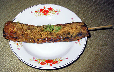 Pig's blood cake coated in peanut powder with dipping sauces