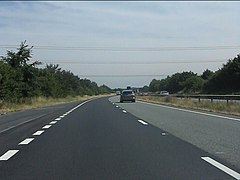 Power lines cross the A14 - geograph.org.uk - 3577875.jpg