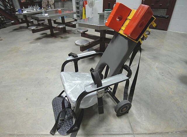 Guantanamo captives who will not comply with force-feeding have their arms, legs and head restrained in a feeding chair. They remain strapped in the c