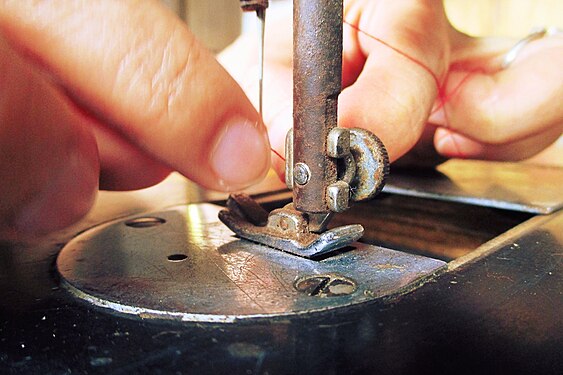 sewing machine's presser foot before a lockstitch operation