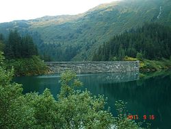 View of the upstream face of the Salmon Creek Dam.