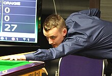 Sam Craigie (pictured) beat defending champion Ali Carter 5-1 to reach his first ranking semi-final. Sam Craigie PHC 2015-2.jpg