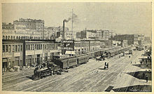 Railroad Avenue, today's Alaskan Way, depicted here in 1900, was built on fill from the early regrades. To the right in this picture, casting shadows, are the wharves of the Central Waterfront. Seattle - Railroad Avenue - 1900.jpg
