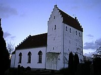 The church of Simris where the runestones were found. Simris kyrka, fran sydvast.jpg