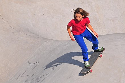 Tomboy girl riding a skateboard