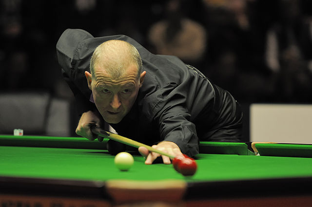 Davis playing a trick shot exhibition during the interval of the 2012 German Masters final