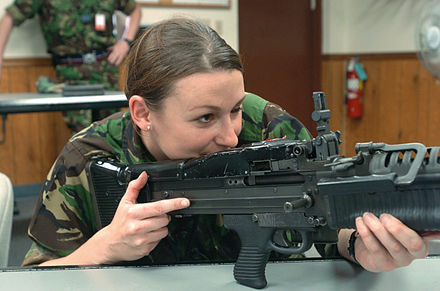 A British Royal Air Force officer handles an M60 during a demonstration for Combined Joint Task Force Exercise (CJTFEX) in 2004.