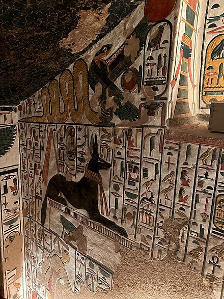Wadjet in the form of a winged cobra, depicted in the Tomb of Nefertari, above Anubis (Jackal-like).