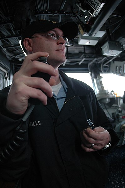 File:US Navy 090203-N-1512O-021 Boatswain's Mate 2nd Class Thomas Mills makes an announcement on the ship's general announcing system.jpg