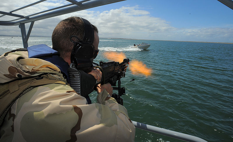 File:US Navy 100422-N-4965F-784 Boatswain's Mate 1st Class Jason Fuchs, a boat crewman gunner assigned to a boat detachment of Maritime Expeditionary Security Squadron (MSRON) 3, engages a simulated waterborne threat.jpg