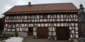 English: Half-timbered building in Helpershain, Vogelsbergstrasse 21, Ulrichstein, Hesse, Germany This is a picture of the Hessian Kulturdenkmal (cultural monument) with the ID Unknown? (Wikidata)