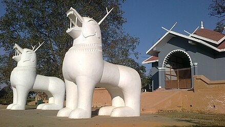 Two standing Kangla-Sa at the northern gate of Kangla Fort. These massive statues have been rebuilt after they were destroyed at the end of the Anglo-Manipur war of 1891.