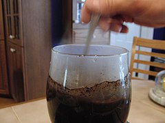 Step 4: The steam forces hot water up the stem of the coffee ground container and mixes with the ground coffee. The mix is then stirred for one minute.