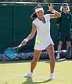 Wang Yafan competing in the first round of the 2015 Wimbledon Qualifying Tournament at the Bank of England Sports Grounds in Roehampton, England. The winners of three rounds of competition qualify for the main draw of Wimbledon the following week.