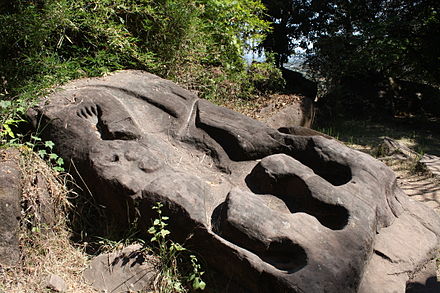Carving of a crocodile on the upper level, possibly the site of an annual human sacrifice in pre-Angkorian times.