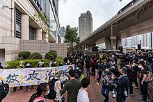 Supporters queueing outside court for a bail hearing with banner saying "release political prisoners" West Kowloon Court queue overview3 20210301.jpg