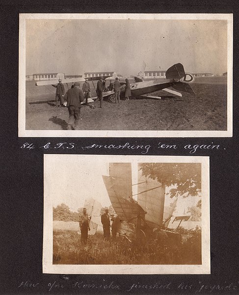 File:"84 C.T.S smashing 'em again" Photograph of several men standing around a crashed aircraft. (3599112714).jpg