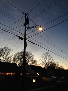 Incandescent street light in Ewing, New Jersey (2014) 2014-12-26 17 01 34 Incandescent street light just after turning on for the night on Fireside Avenue at Meridan Avenue in Ewing, New Jersey.JPG