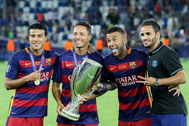 Adriano (second from the left) posing with the 2015 UEFA Super Cup, alongside compatriots Rafinha, Dani Alves and Douglas.