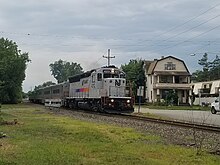 NJ Transit GP-40PH-2 4213 leading an outbound Pascack Valley Line train at Main St. level crossing in Hackensack, N.J. 20220905 181226 NJT GP40 4213.jpg