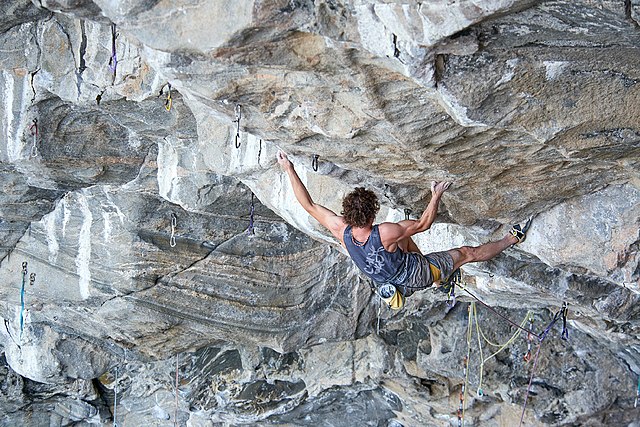 Ondra toe-hooking the start of the first crux (July 2017)