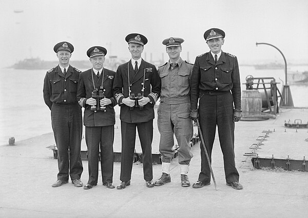 Rear Admiral Tennant (centre) with his officers on Mulberry B, Arromanches, July 1944