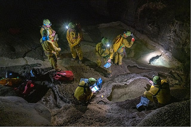 Astronauts looking for water and microbiological samples during CAVES