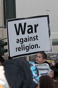 Haredi boy holding a protest sign Atzere5.JPG