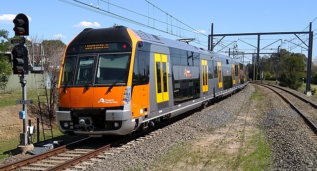 A Sydney Trains B set with an upper and lower deck